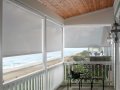 Bali Blinds style Shoji Exterior Solar Roller Shades are a diamond shaped texture fabric roller shade.